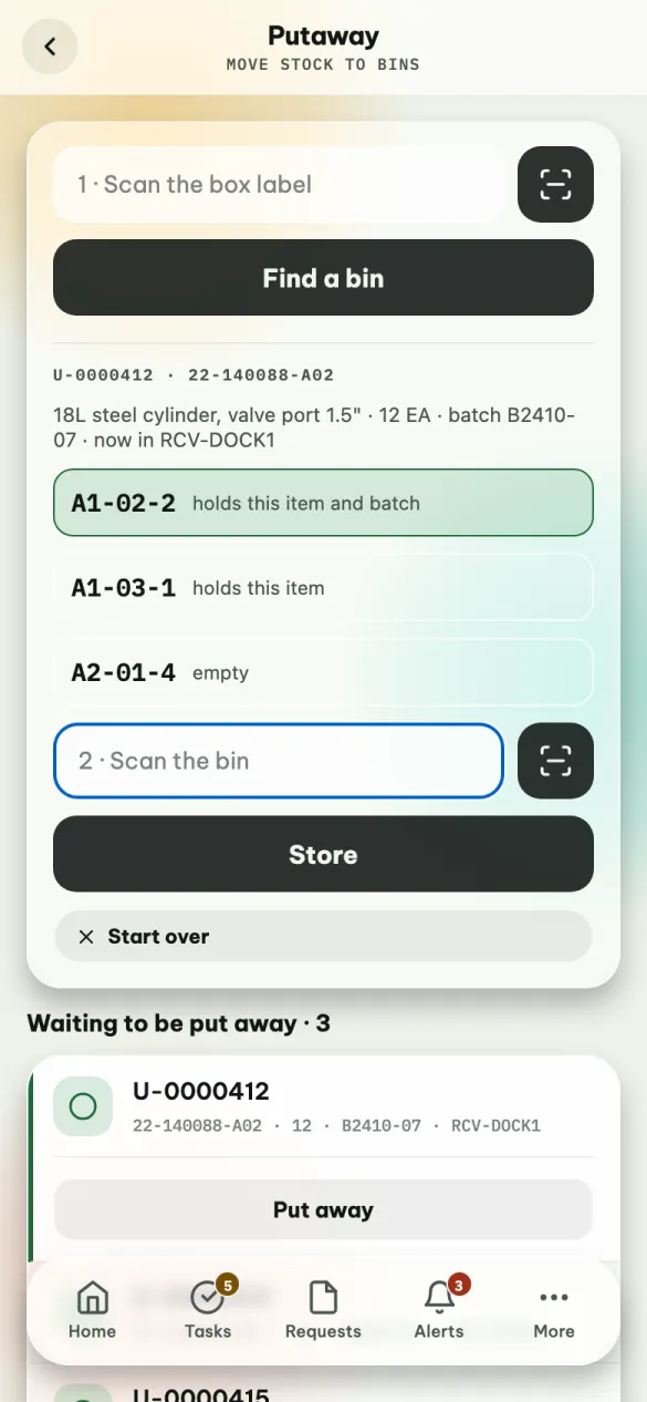 Putaway after tapping Put away on a waiting box: the box's code, item and batch, three suggested bins with the first highlighted, the Scan the bin box and Store, and the list of boxes waiting to be put away.